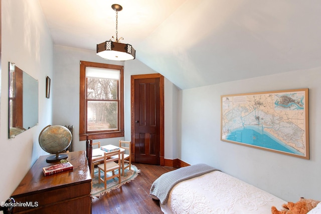 bedroom with dark wood-type flooring, baseboards, and lofted ceiling