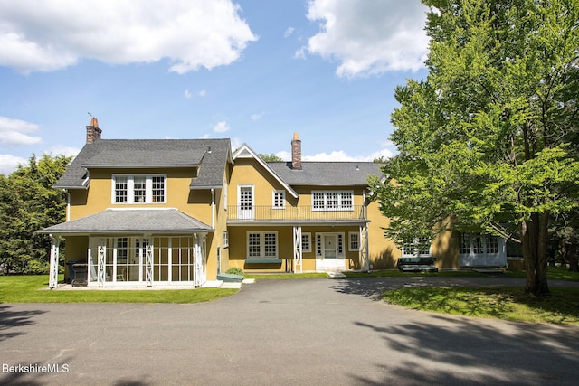82 W Ave, Great Barrington, MA 01230 - view of front of property with french doors, a chimney, stucco siding, and asphalt driveway
