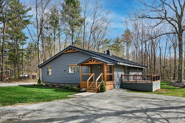 23 Pine St, Otis, MA 01253 - rustic home featuring a wooden deck, a chimney, and a front lawn