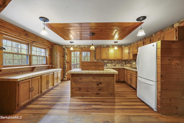 189 Cross Place Rd, Washington, MA 01223 - kitchen featuring tile counters, a kitchen island, freestanding refrigerator, and dark wood-style floors