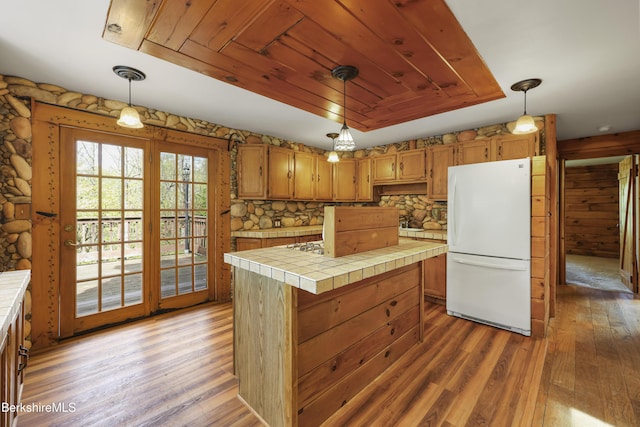 189 Cross Place Rd, Washington, MA 01223 - kitchen with freestanding refrigerator, tile countertops, light wood-style floors, a kitchen island, and wooden ceiling
