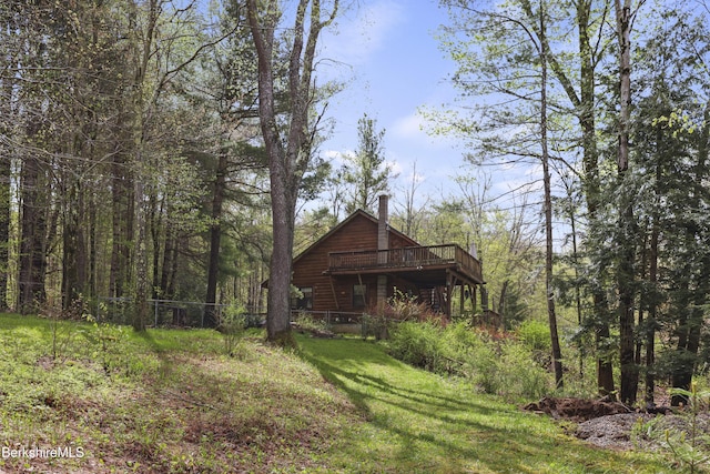 189 Cross Place Rd, Washington, MA 01223 - view of home's exterior featuring a deck, a chimney, fence, and a view of trees