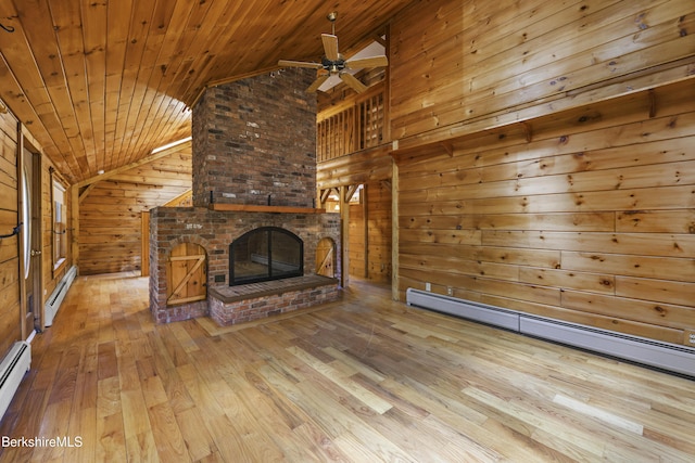 189 Cross Place Rd, Washington, MA 01223 - unfurnished living room with a baseboard radiator, vaulted ceiling, wood walls, wood-type flooring, and wood ceiling