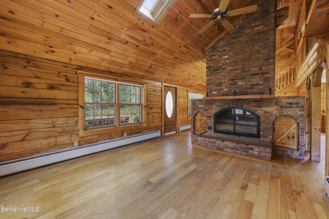 189 Cross Place Rd, Washington, MA 01223 - unfurnished living room featuring high vaulted ceiling, baseboard heating, hardwood / wood-style floors, a ceiling fan, and wooden walls
