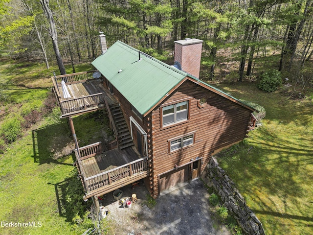 189 Cross Place Rd, Washington, MA 01223 - view of front of home with a chimney, a deck, stairs, an attached garage, and log siding