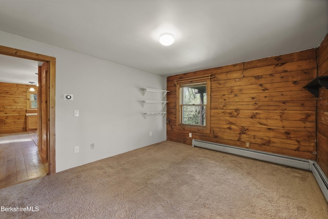 189 Cross Place Rd, Washington, MA 01223 - empty room featuring wooden walls, carpet, and a baseboard heating unit