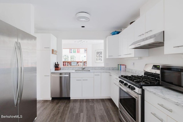 80 Taconic Ave # 14, Great Barrington, MA 01230 - kitchen with appliances with stainless steel finishes, under cabinet range hood, dark wood finished floors, and white cabinets