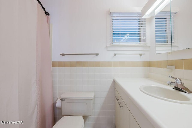80 Taconic Ave # 14, Great Barrington, MA 01230 - full bathroom with vanity, tile walls, wainscoting, and curtained shower