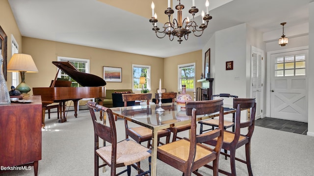 764 E Hill Rd, New Marlborough, MA 01230 - dining space featuring carpet, a chandelier, and a fireplace