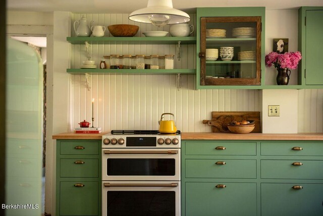 9 Yale Hill Rd, Stockbridge, MA 01262 - kitchen featuring green cabinets, double oven range, open shelves, and butcher block counters