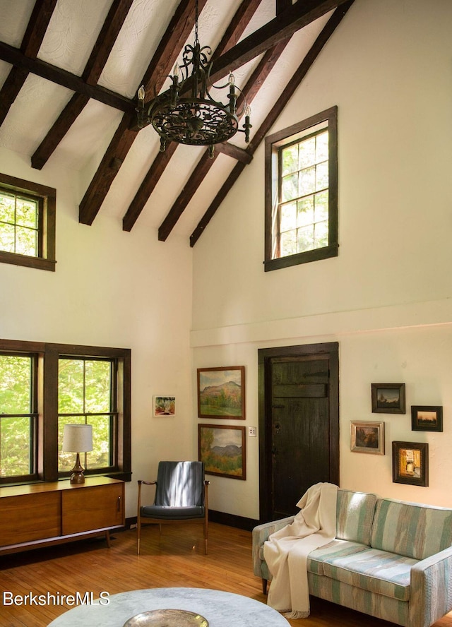 9 Yale Hill Rd, Stockbridge, MA 01262 - living room with high vaulted ceiling, beam ceiling, wood finished floors, a chandelier, and baseboards