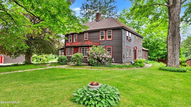 colonial home with a front yard