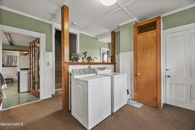 laundry room featuring washer and dryer, wainscoting, and laundry area