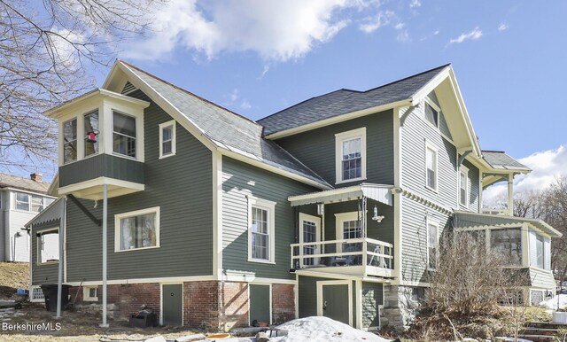 exterior space featuring brick siding