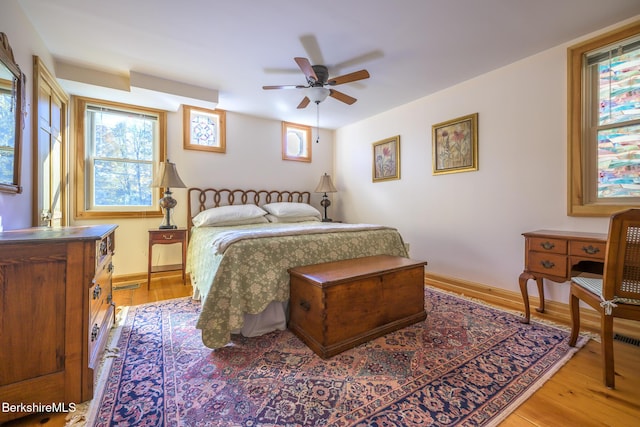 bedroom with ceiling fan and light wood-type flooring