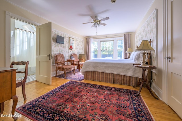 bedroom with light hardwood / wood-style floors and ceiling fan