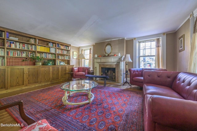 living room with hardwood / wood-style floors and ornamental molding