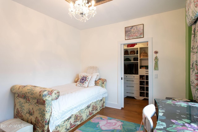 34 Bridge St, Great Barrington, MA 01230 - bedroom with wood finished floors, a walk in closet, a chandelier, and a closet
