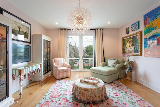 34 Bridge St, Great Barrington, MA 01230 - living area with french doors, a chandelier, wood finished floors, and recessed lighting