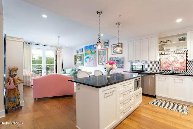 34 Bridge St, Great Barrington, MA 01230 - kitchen featuring appliances with stainless steel finishes, light wood finished floors, dark countertops, open shelves, and recessed lighting