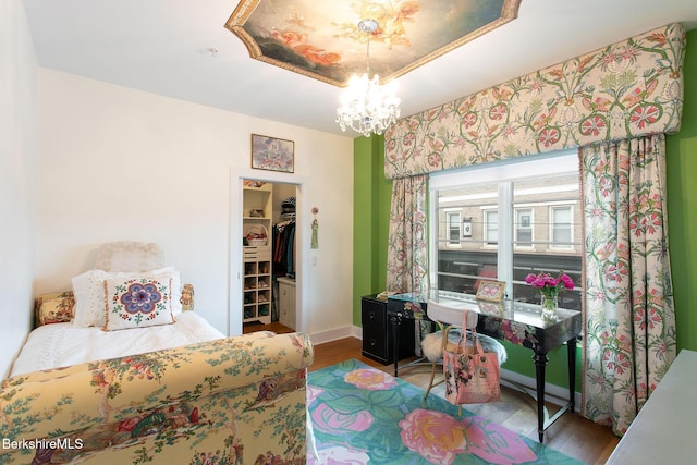 34 Bridge St, Great Barrington, MA 01230 - bedroom with a chandelier, wood finished floors, a spacious closet, and a closet