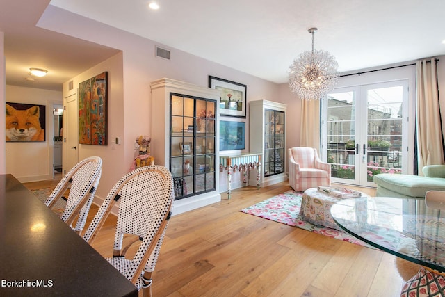 34 Bridge St, Great Barrington, MA 01230 - living room with french doors, wood finished floors, a chandelier, and recessed lighting