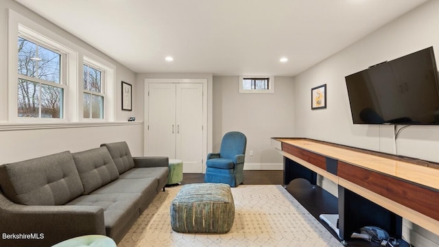 living room with recessed lighting, wood finished floors, and baseboards