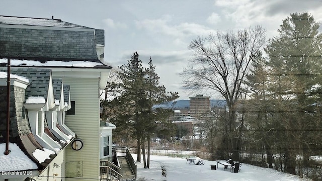 view of yard layered in snow