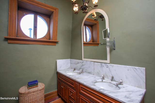 bathroom featuring vanity and a notable chandelier