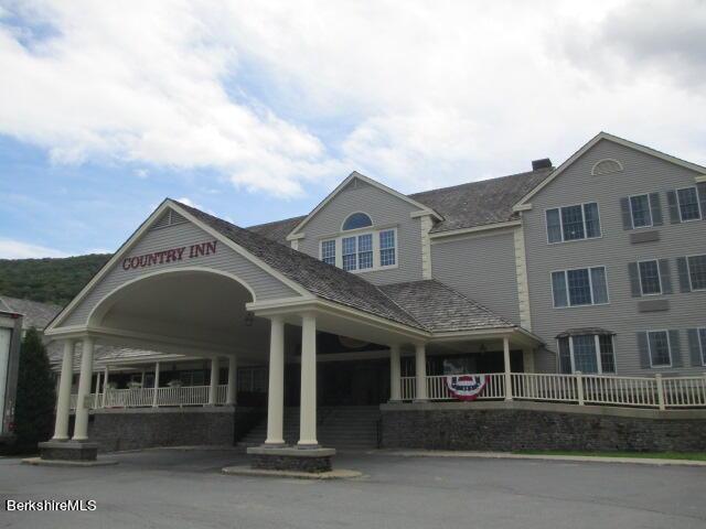 view of property featuring aphalt driveway