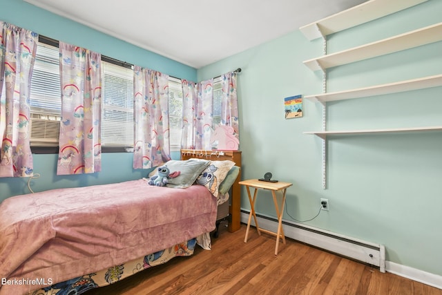 68 Tower Rd, Dalton, MA 01226 - bedroom with a baseboard heating unit and wood finished floors
