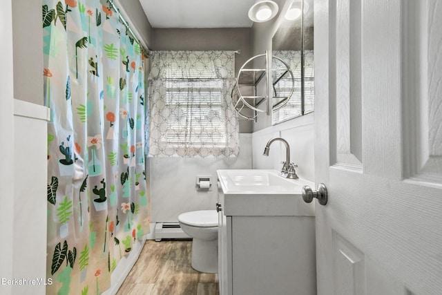 68 Tower Rd, Dalton, MA 01226 - bathroom with a baseboard radiator, vanity, wood finished floors, and a shower with shower curtain