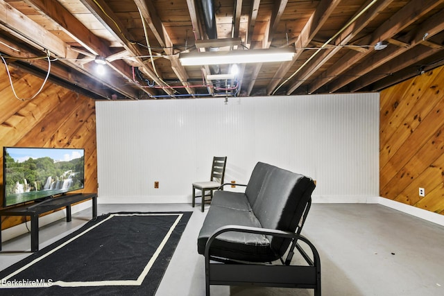 68 Tower Rd, Dalton, MA 01226 - living area featuring finished concrete flooring and wood walls