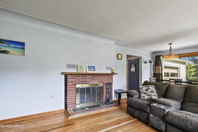 68 Tower Rd, Dalton, MA 01226 - living room featuring wood finished floors and a brick fireplace