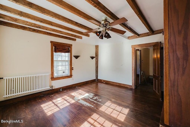 empty room with beamed ceiling, ceiling fan, radiator heating unit, and dark hardwood / wood-style flooring