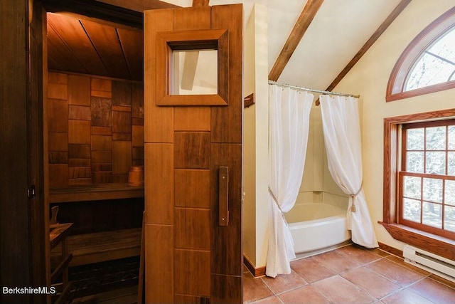 bathroom with tile patterned flooring, a baseboard radiator, lofted ceiling, and shower / bath combo with shower curtain