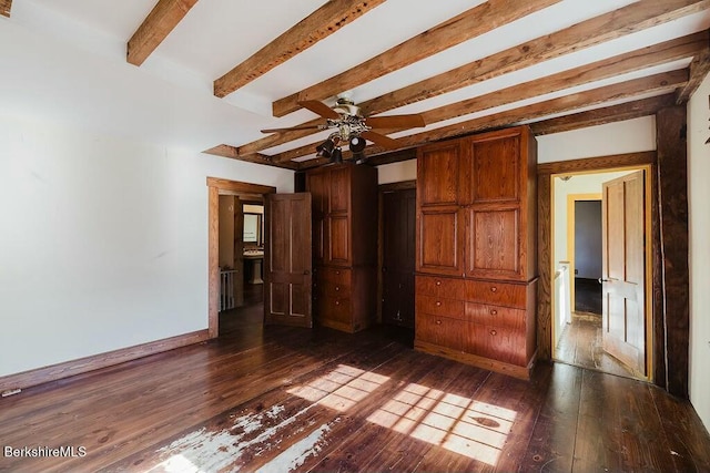 unfurnished bedroom with dark hardwood / wood-style flooring, beam ceiling, a closet, and ceiling fan