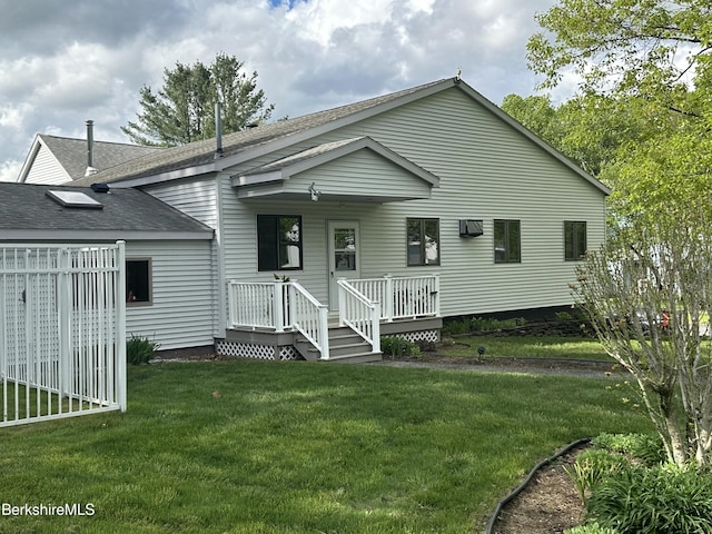 9 Rolling Hls Unit 5, Lenox, MA 01240 - view of front of property featuring a front yard, a wall mounted AC, covered porch, and a shingled roof