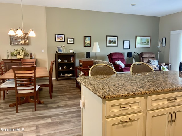 9 Rolling Hls Unit 5, Lenox, MA 01240 - kitchen featuring light wood-type flooring, stone counters, a chandelier, and open floor plan