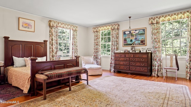 bedroom with light wood-type flooring