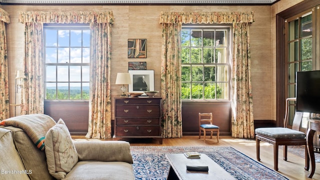 living area with hardwood / wood-style floors