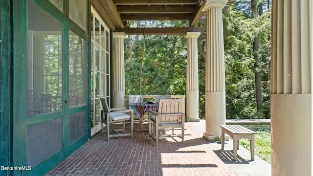 sunroom / solarium with ornate columns