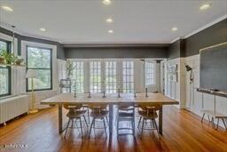 dining area with recessed lighting and wood finished floors
