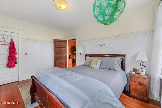bedroom featuring wood finished floors