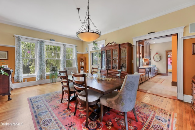 dining space featuring light wood-style flooring