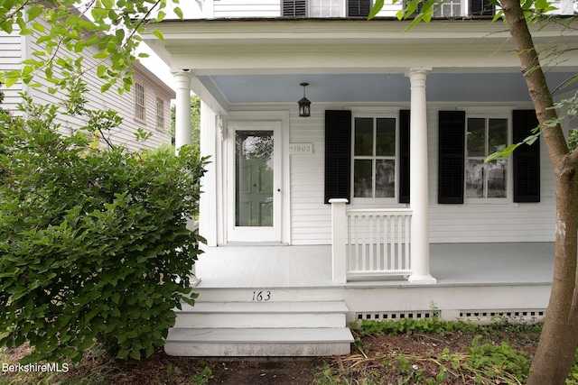 entrance to property with covered porch