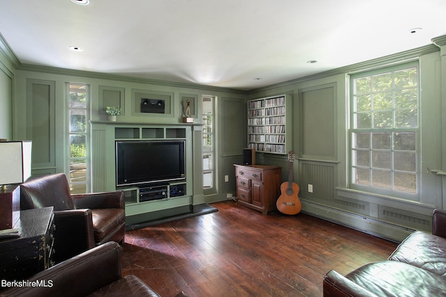 living room featuring dark hardwood / wood-style flooring, ornamental molding, and a baseboard radiator