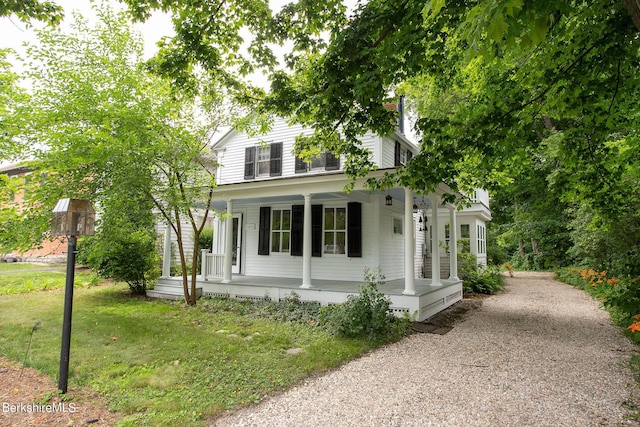 view of front facade with a porch and a front yard