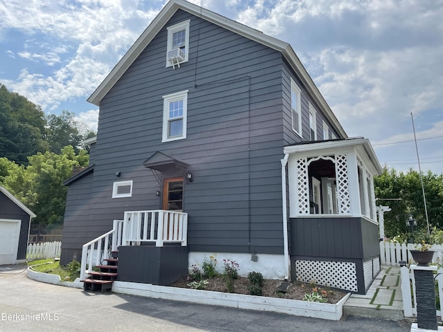 view of front of home featuring fence