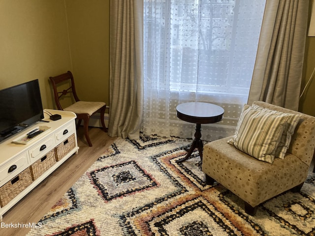 sitting room featuring wood finished floors